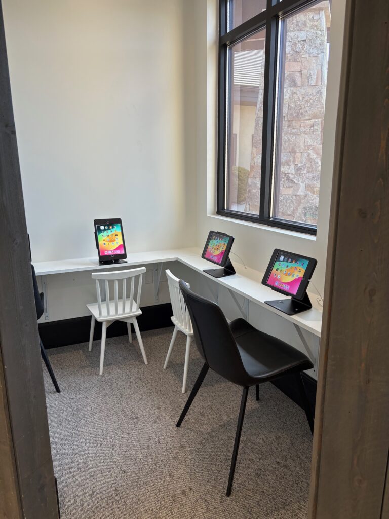 Kids game room with iPads in the waiting area