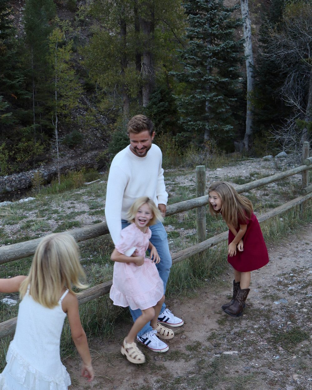 Dr. Austin Williams laughing with his daughters